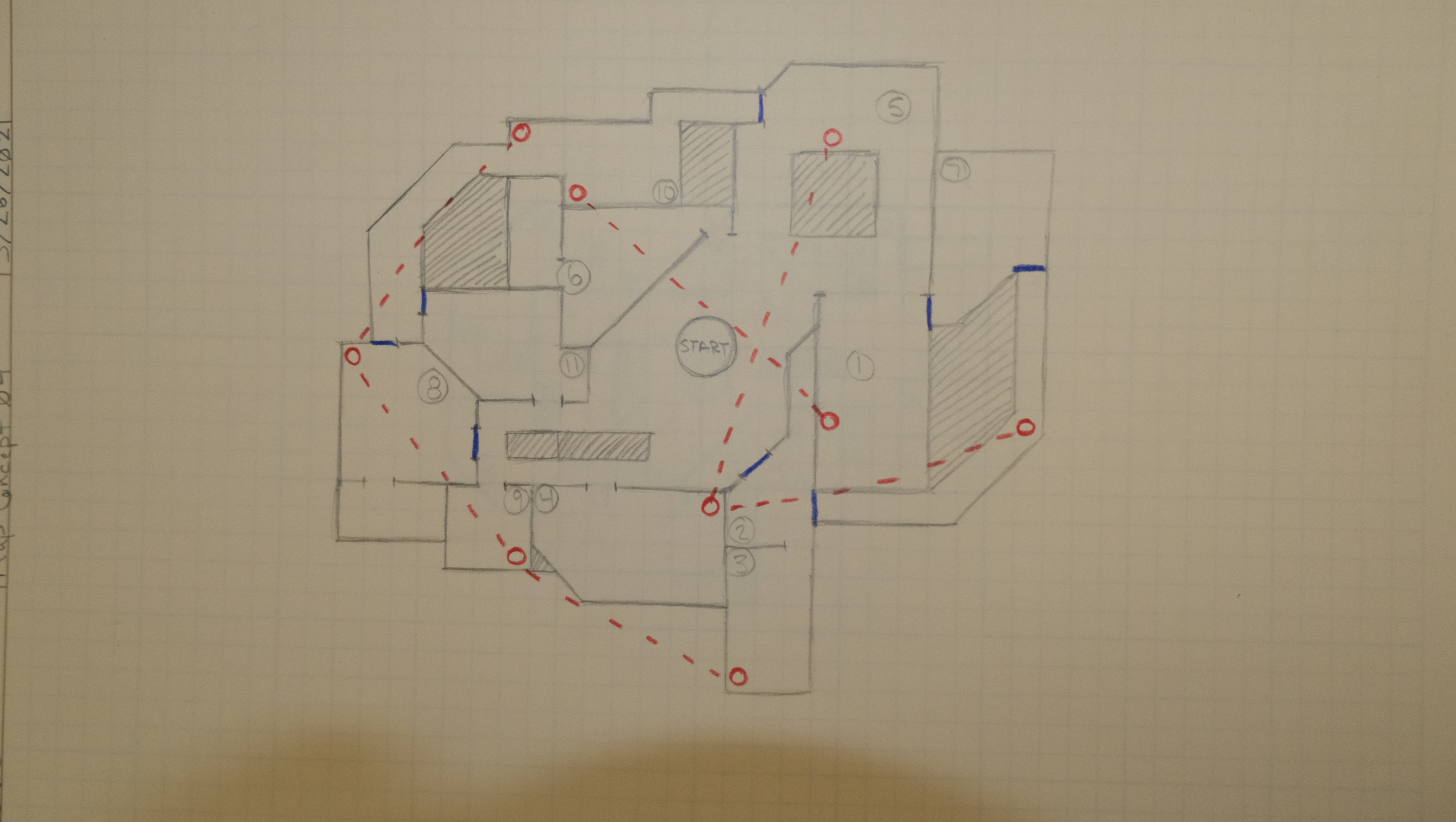 A hand drawn topdown level sketch on graph paper displaying a possible mall layout