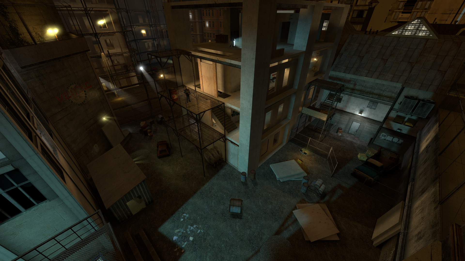 A Source engine screenshot of the Half Life 2 beta displaying a construction site with the poured foundation of a building, scaffolding, and piles of supplies
