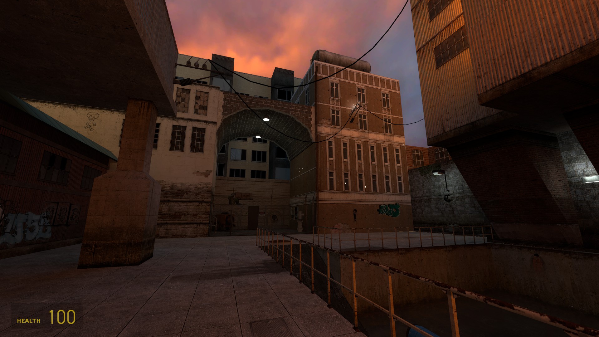 A Source Engine screenshot displaying an eastern european alleyway during the sunset complete with grafitti, wires, and shoddy construction