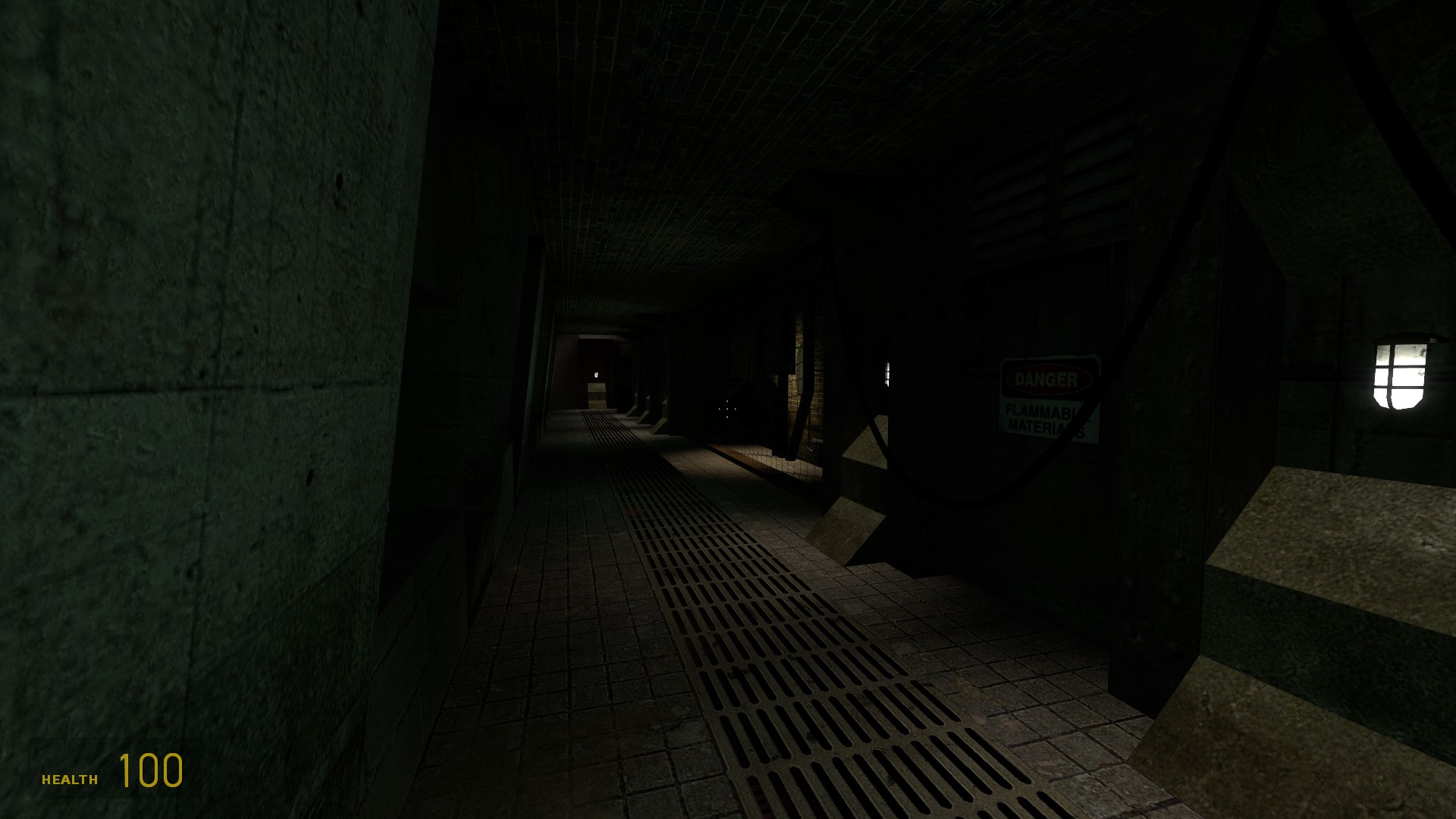 A Source Engine screenshot displaying a dark concrete hallway with cage lights, metal floors, and brutalis pillars