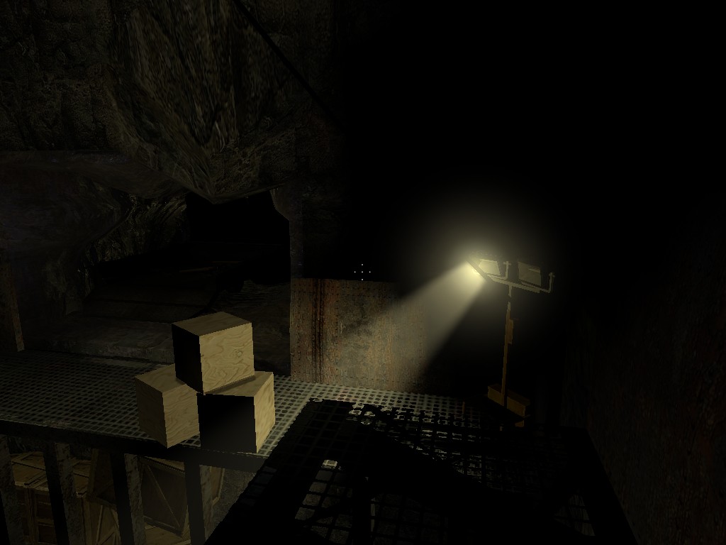 A Source Engine screenshot displaying a pathway through a stone mine illuminated by a single work light