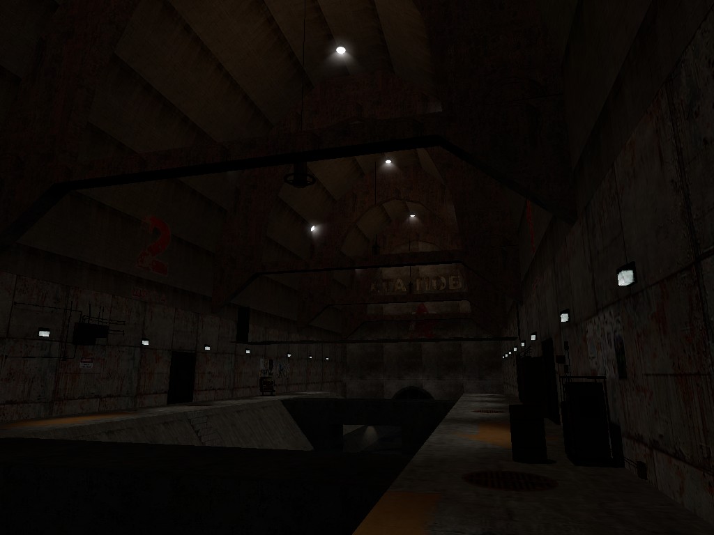 A Source Engine screenshot displaying a large, arched chamber with rusting metal walls and a canal